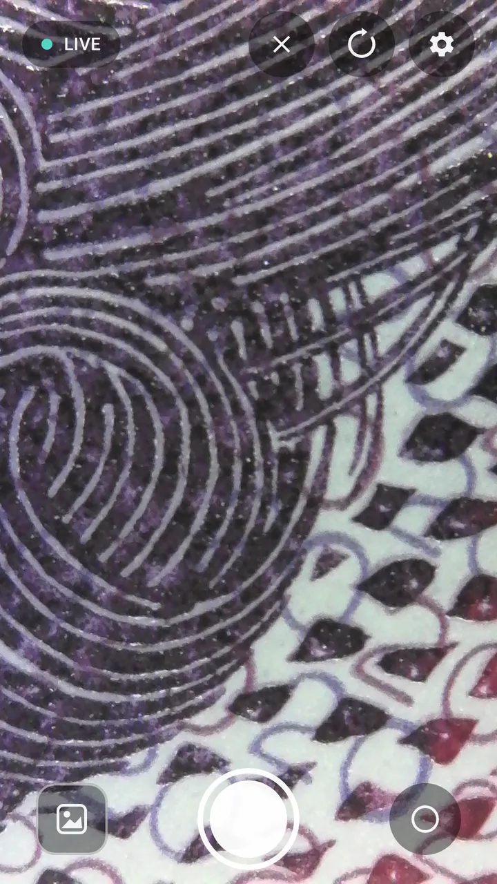 xploview Android wireless app showing magnified printed detail with capture controls